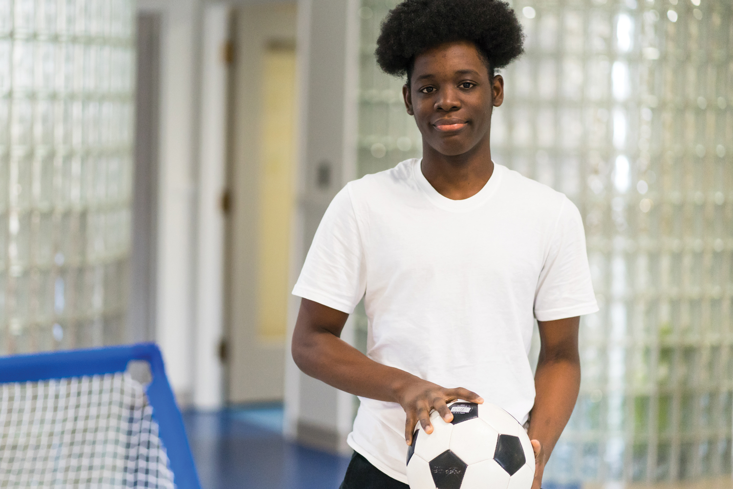 teen holding soccer ball sports mega menu long 05